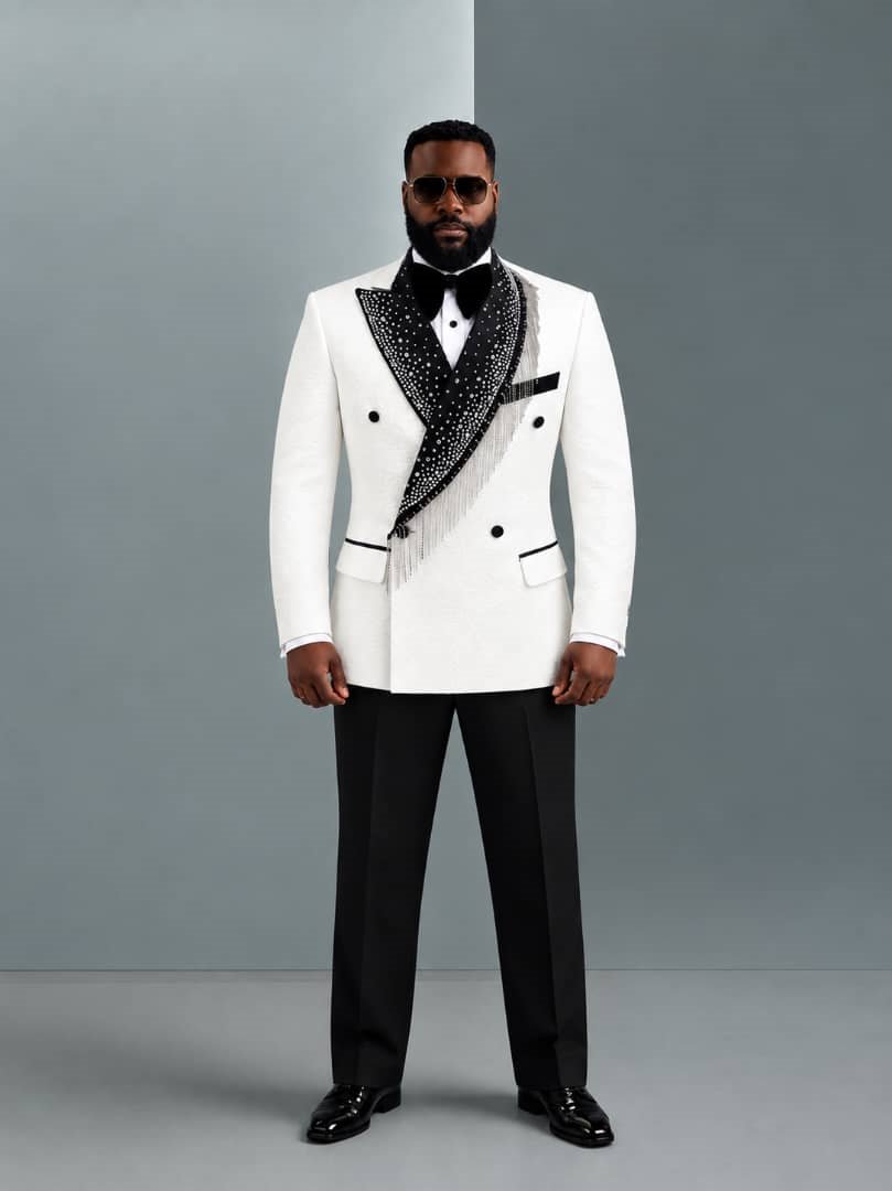 Groom in an ivory crystal-fringe double-breasted tuxedo