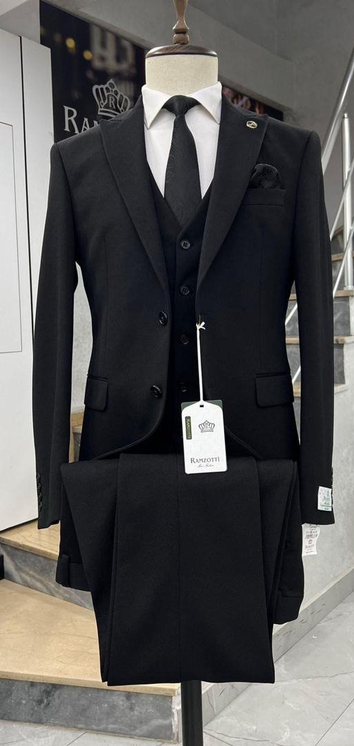 Executive Look: classic black peak-lapel three-piece suit